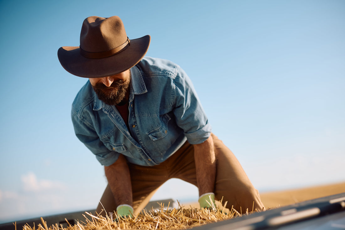 happy farmer holding and picking up 